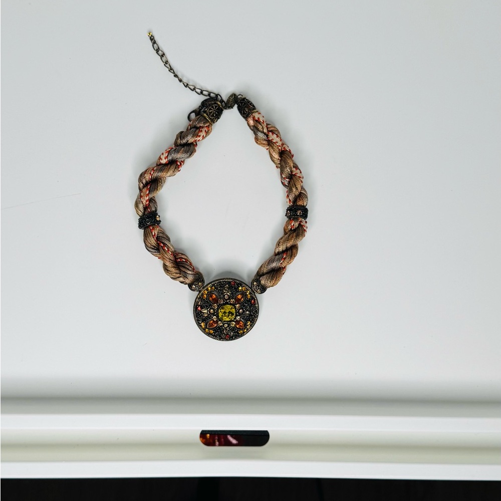 Elegant Braided Necklace with Intricate Pendant